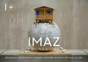 Model house on a globe representing IMAZ Foundation's global impact.
