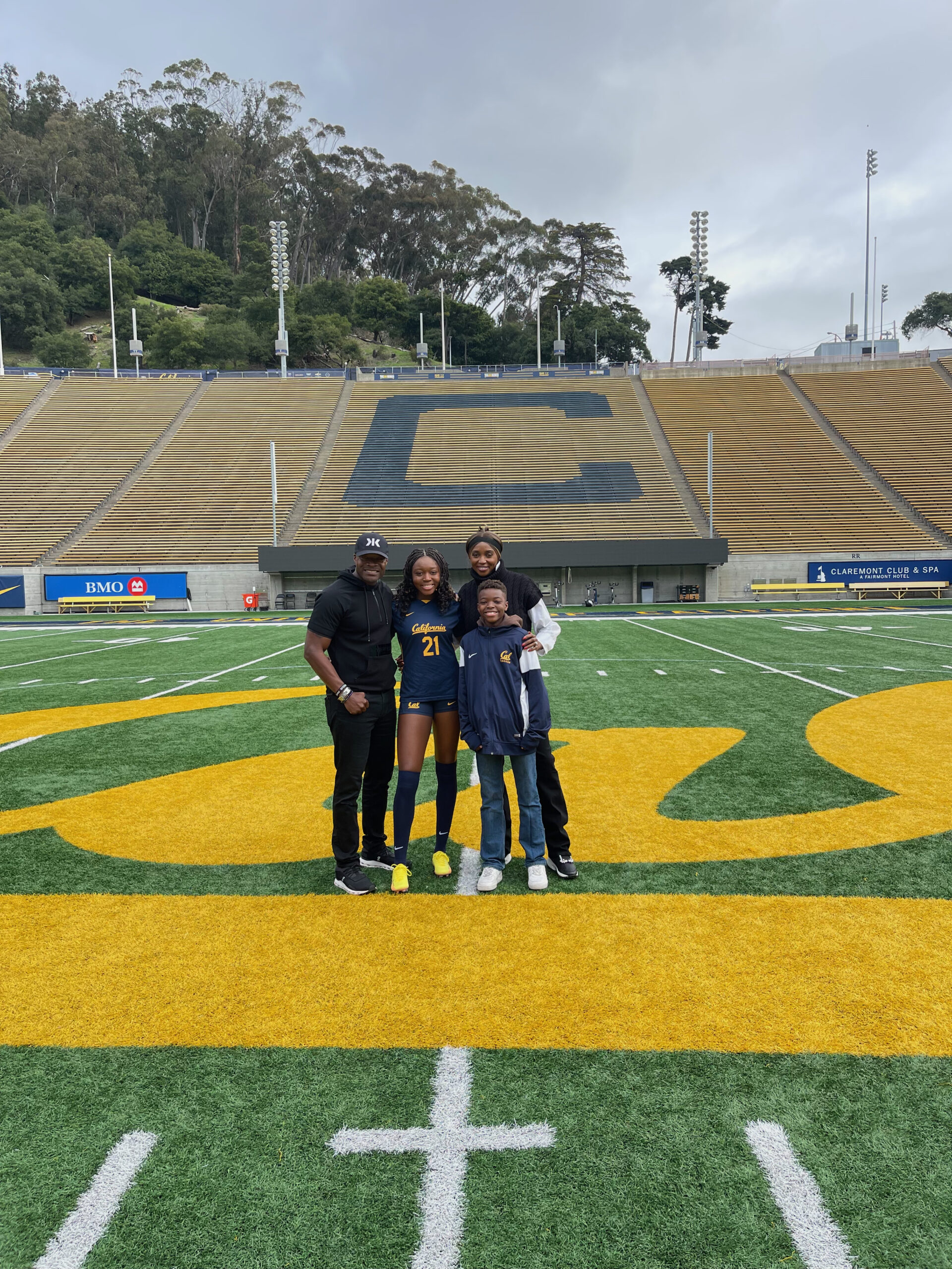 Field Notes 007 – Image 1 The Nartey family standing together on the field at UC Berkeley during Liya’s official recruiting visit.