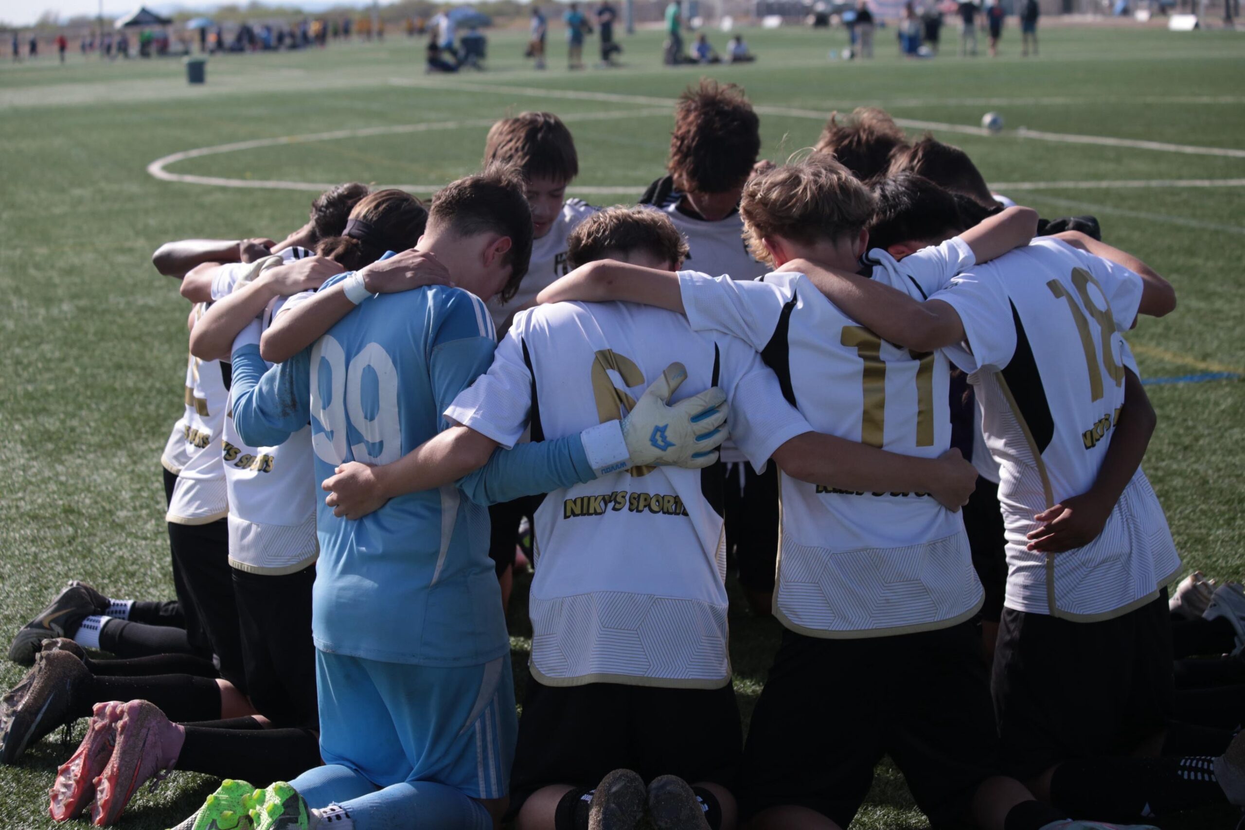 Lincoln's MLS NEXT team huddled together before a match.