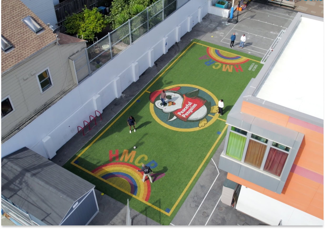 Colorful Playground on Rooftop Rooftop playground with colorful designs and children playing.