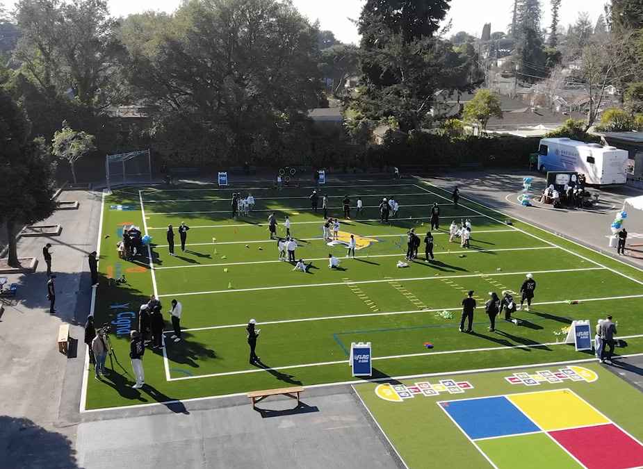 Modern multi-sport outdoor court with various activities and equipment.